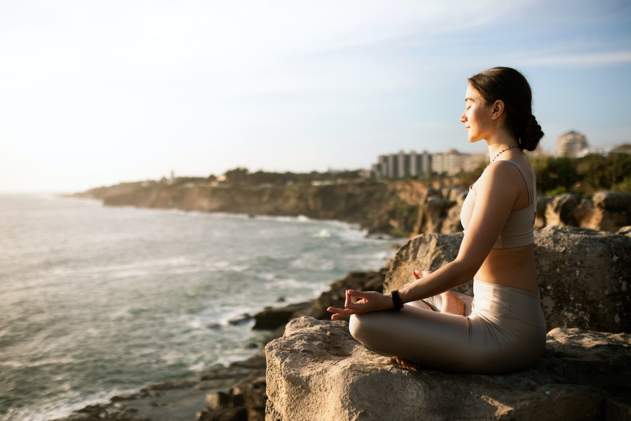 glad-calm-slim-millennial-european-female-in-sportswear-practicing-yoga-enjoy-training-meditating